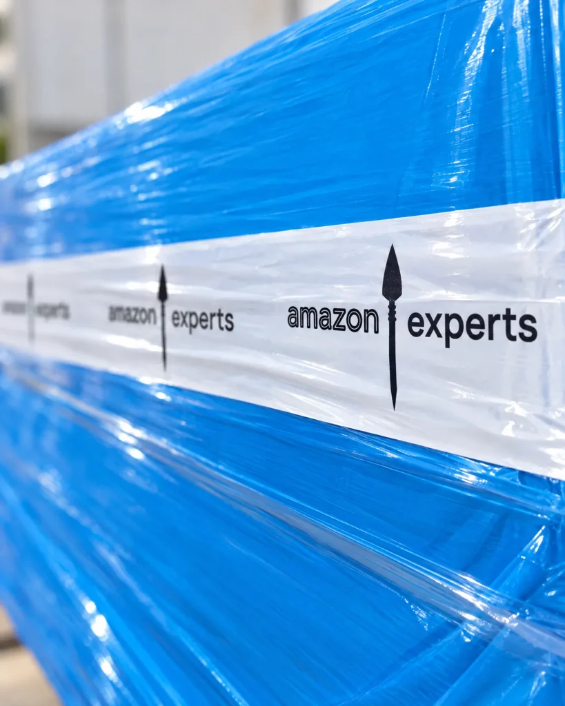 A pallet in blue stretch film sealed with Amazon Experts branded tape