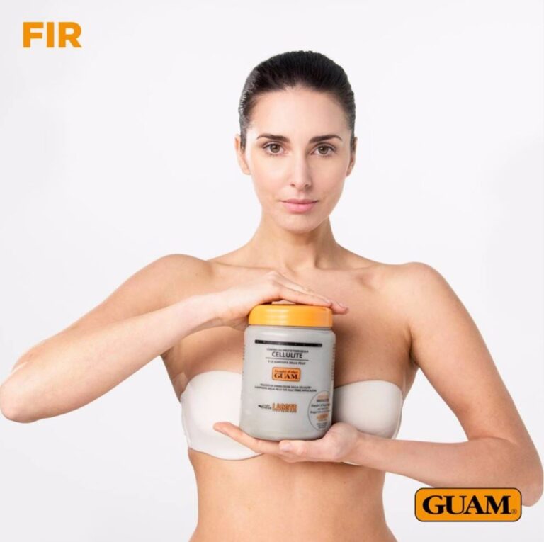A woman holding a jar of GUAM FIR seaweed mud