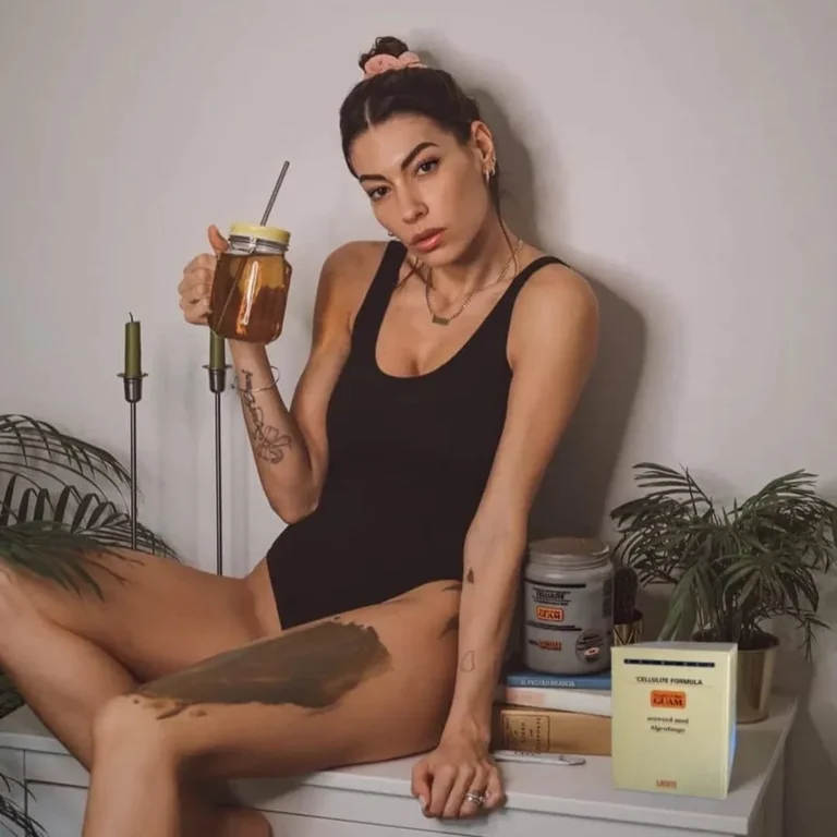A woman relaxing at home with GUAM seaweed mud applied