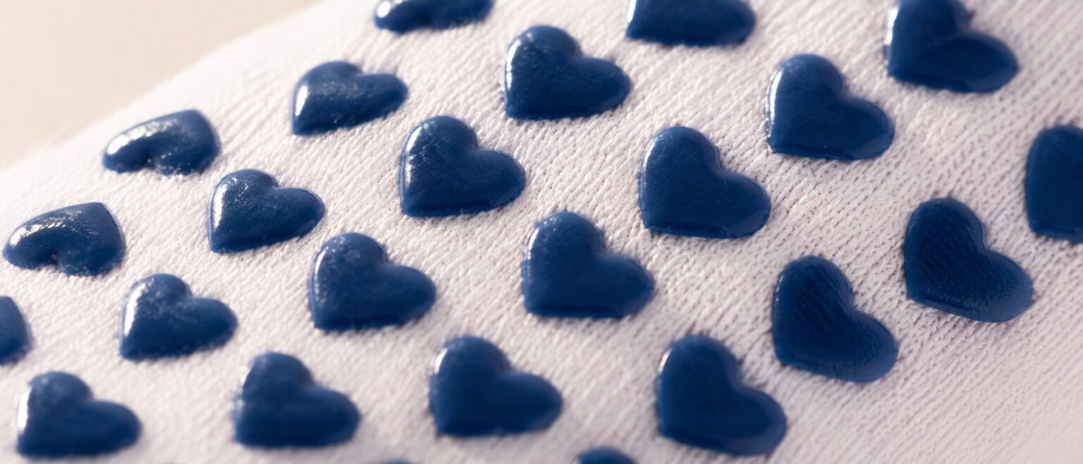 Navy heart silicone grips on the sole of LISAMAREE American Sweetheart socks